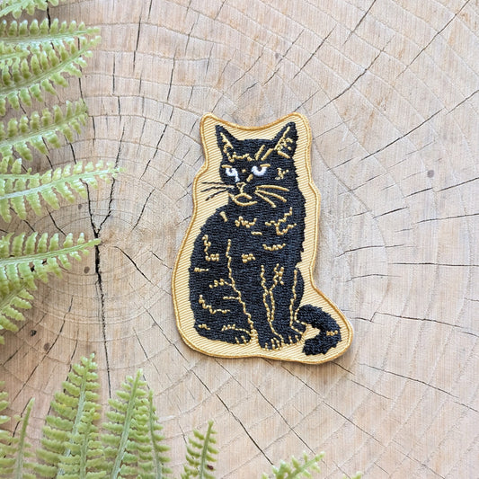 iron-on patch | sitting black disappointed cat 2.9" x 2.2"