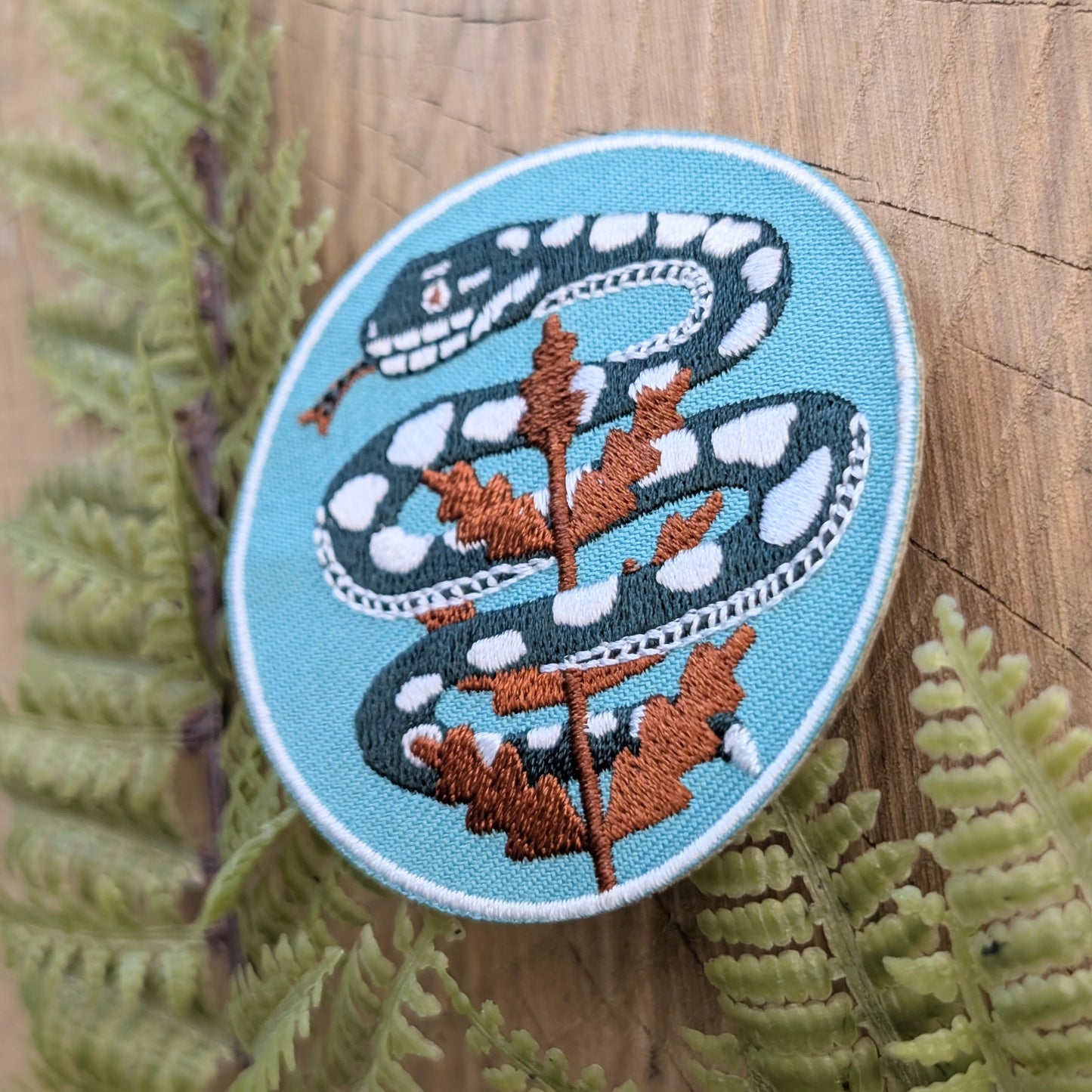 iron-on patch | serpent with fern - light teal blue snake