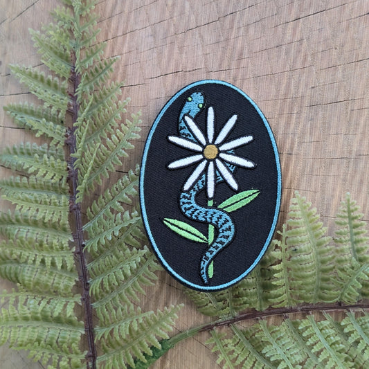 iron-on patch | serpent with daisy - snake & flower on black
