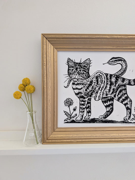 handprinted blockprint | caught (snake coiled around cat)