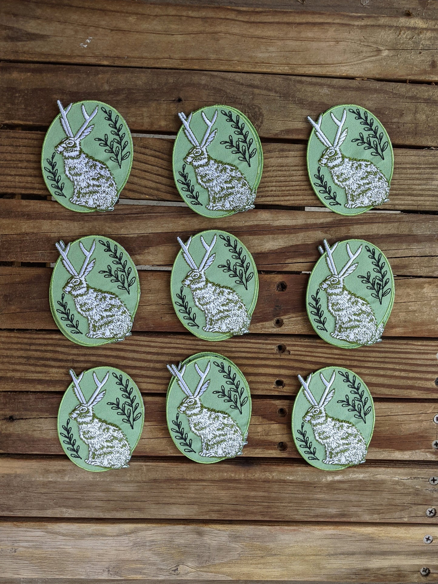 iron-on patch | jackalope - green oval 2.5" x 3.2"