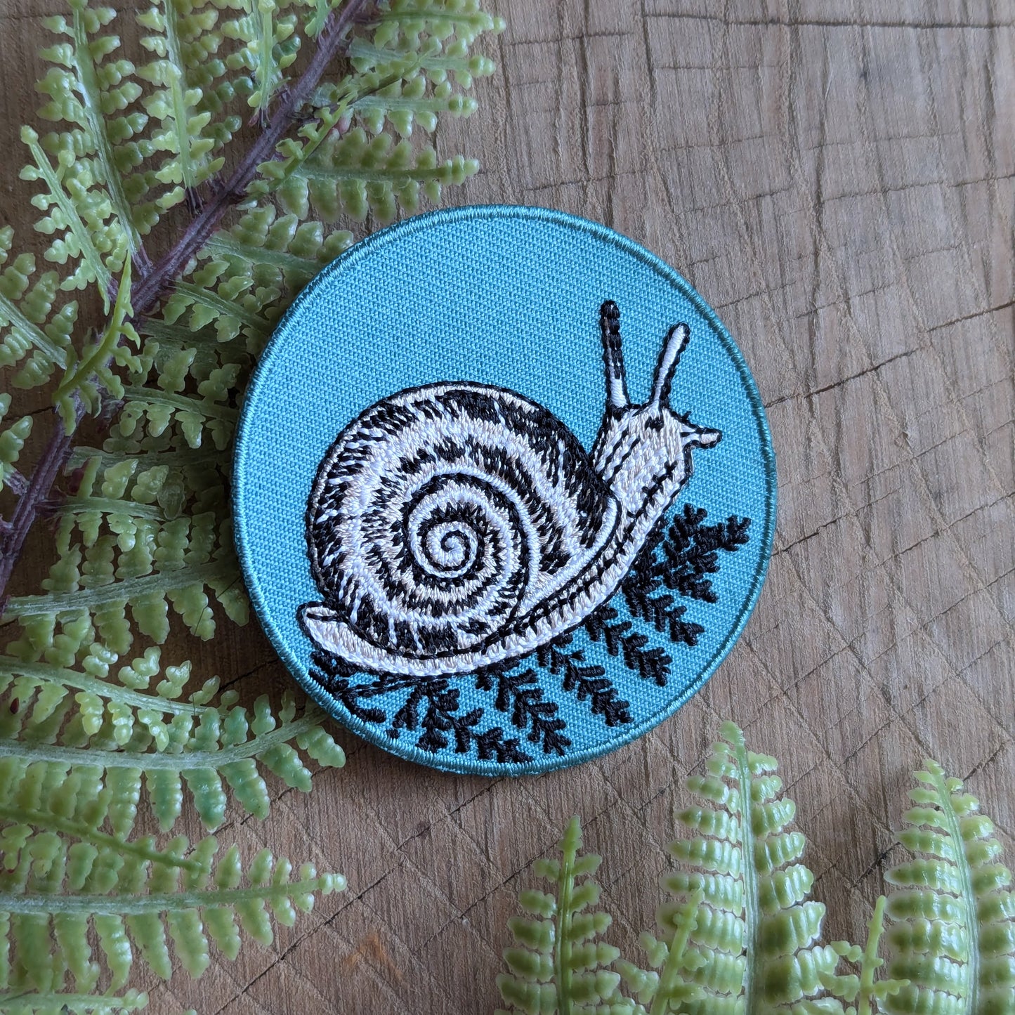 iron-on patch | snail with fern - 2.5" round teal