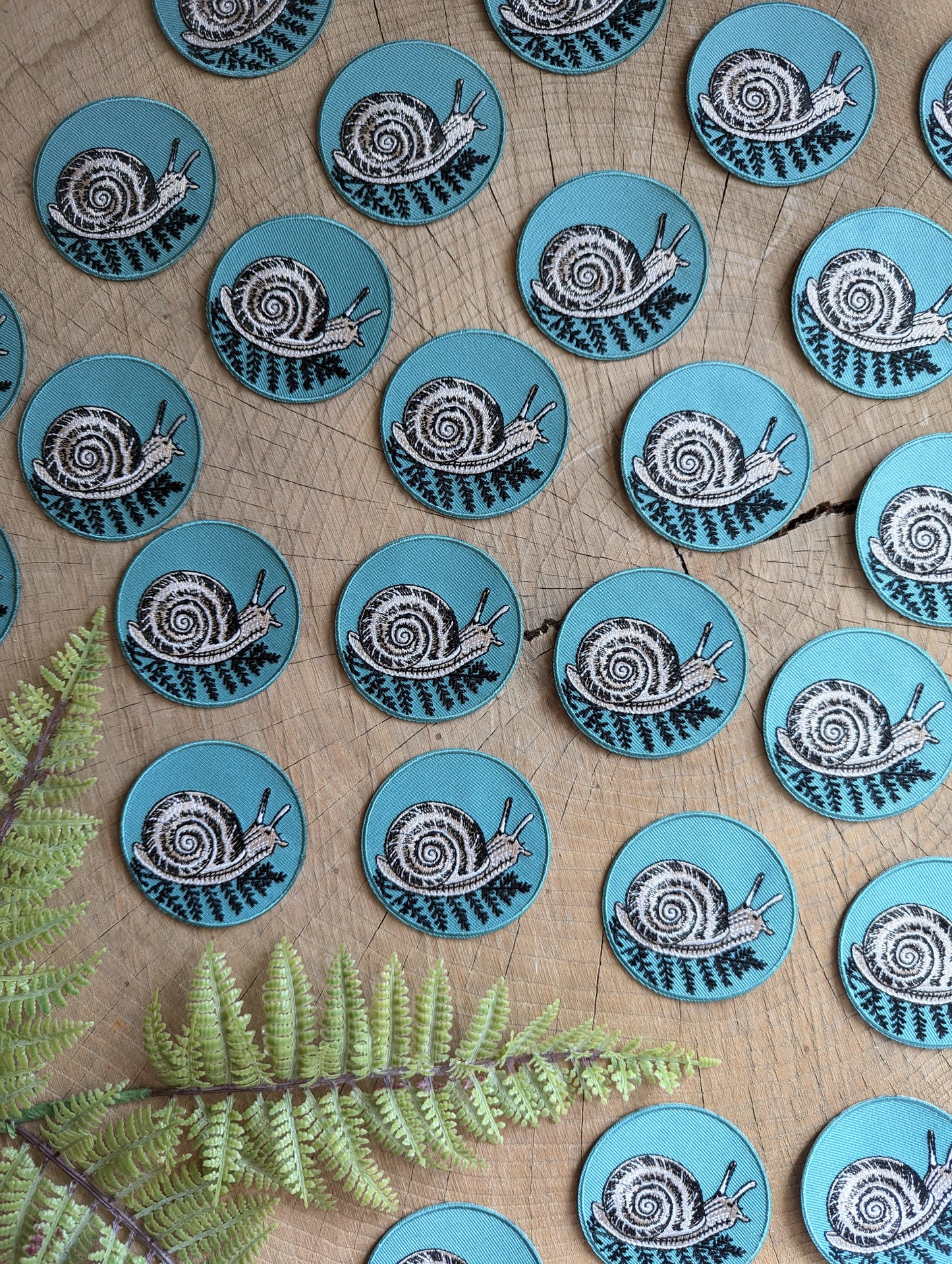 iron-on patch | snail with fern - 2.5" round teal