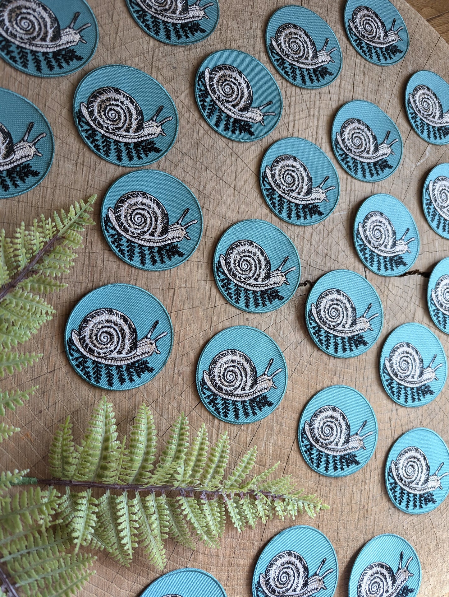 iron-on patch | snail with fern - 2.5" round teal