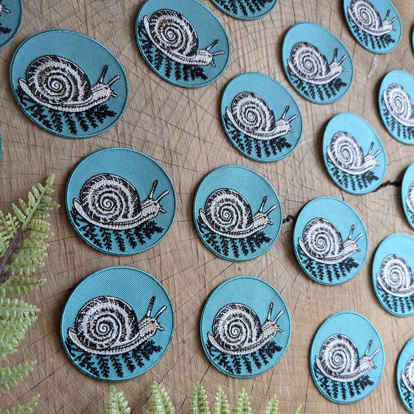 iron-on patch | snail with fern - 2.5" round teal