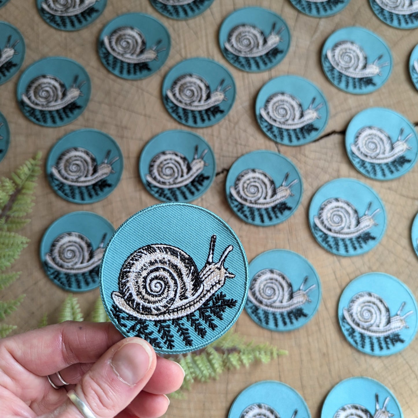iron-on patch | snail with fern - 2.5" round teal