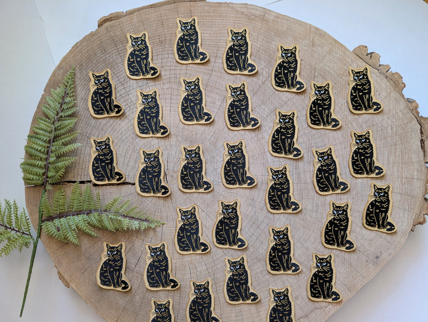 iron-on patch | sitting black disappointed cat 2.9" x 2.2"