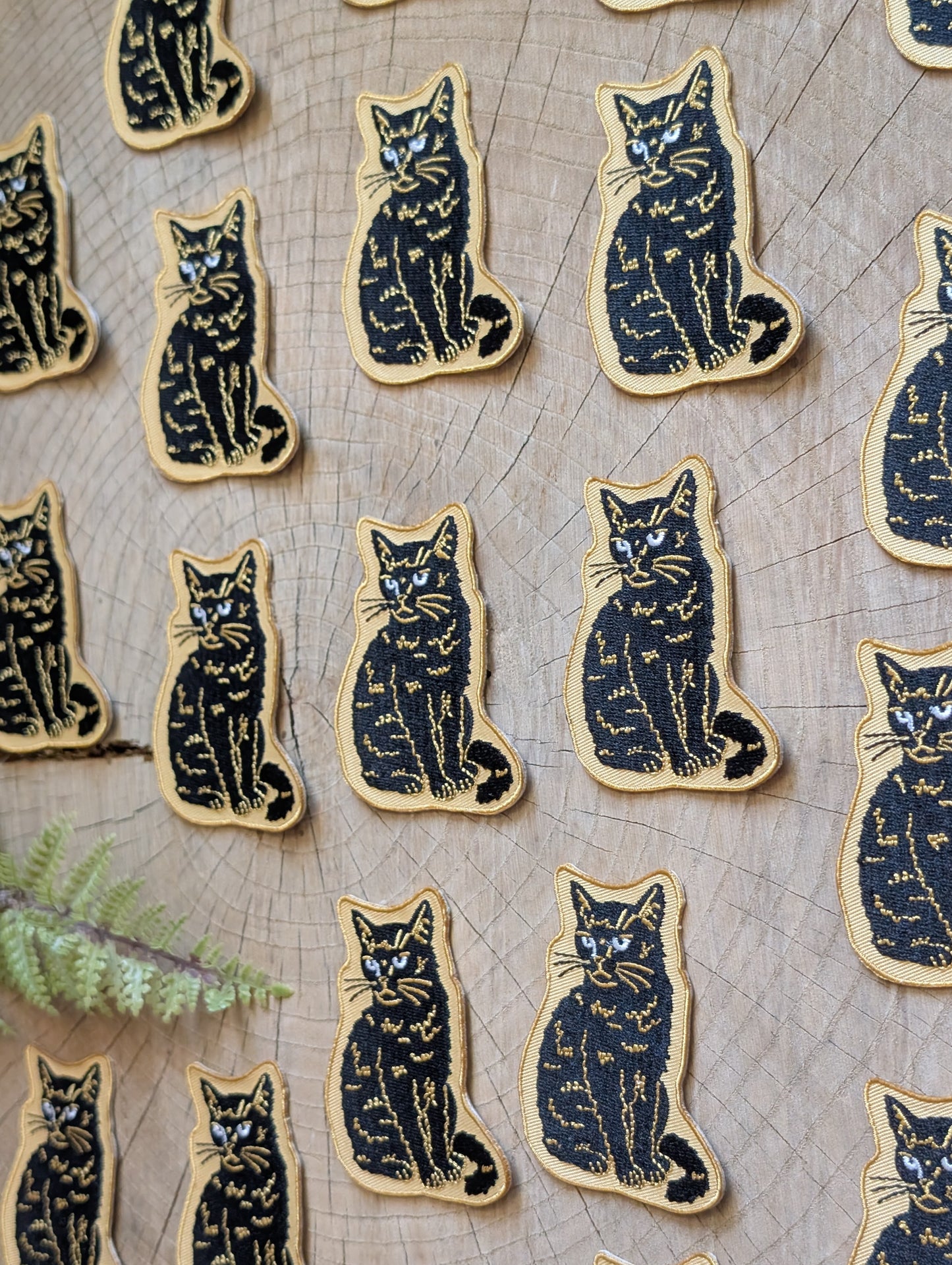 iron-on patch | sitting black disappointed cat 2.9" x 2.2"