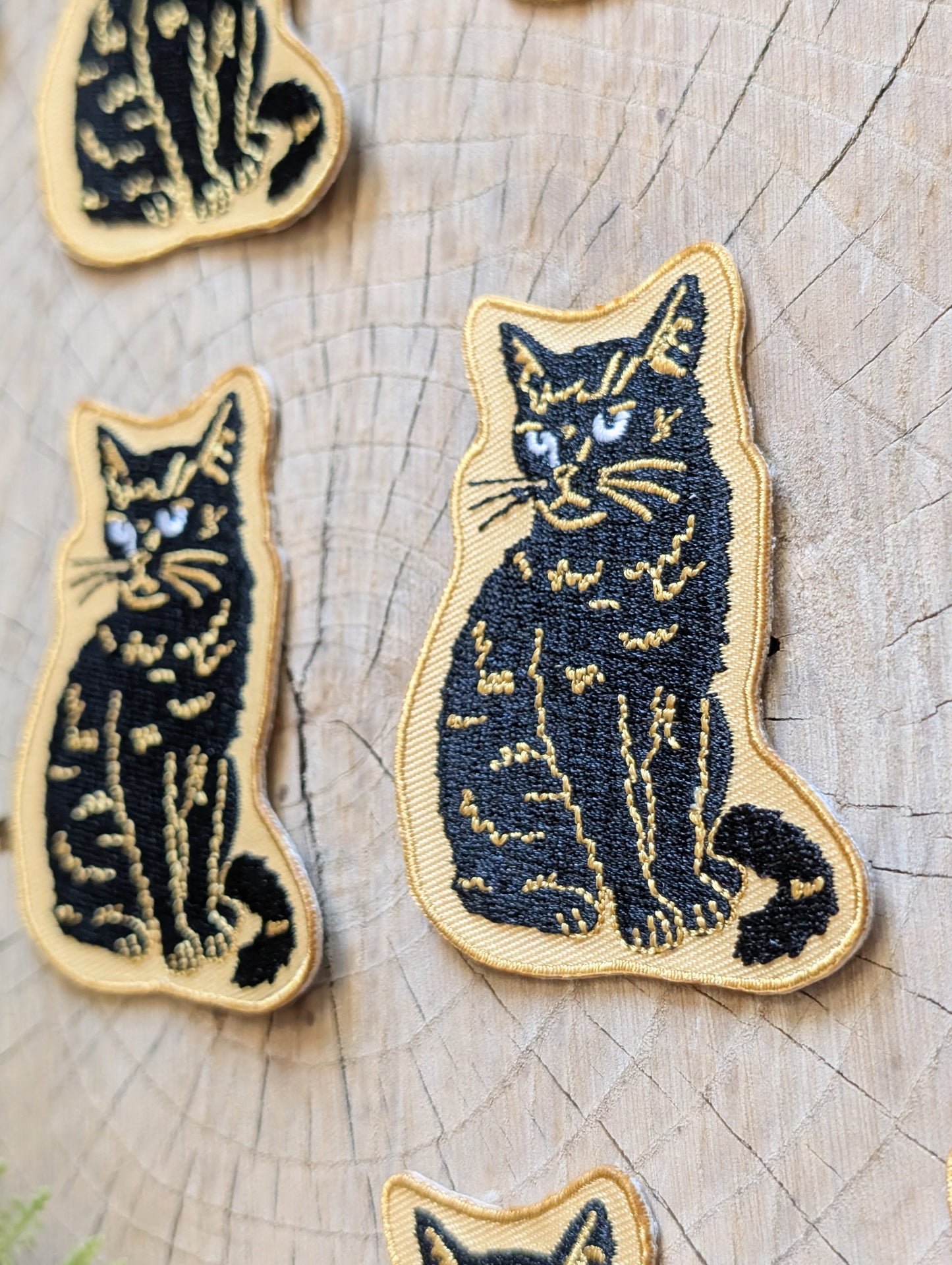 iron-on patch | sitting black disappointed cat 2.9" x 2.2"