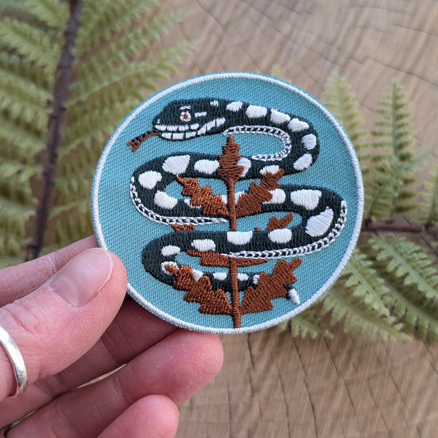 iron-on patch | serpent with fern - light teal blue snake