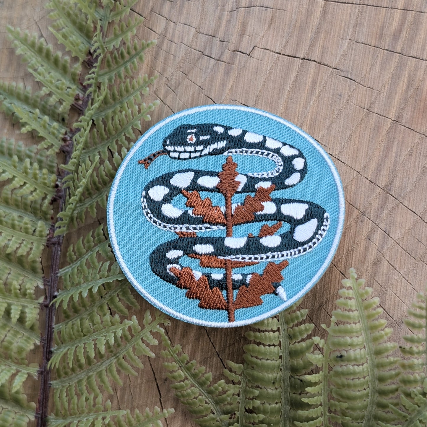 iron-on patch | serpent with fern - light teal blue snake