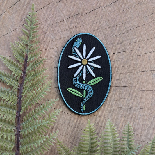 iron-on patch | serpent with daisy - snake & flower on black