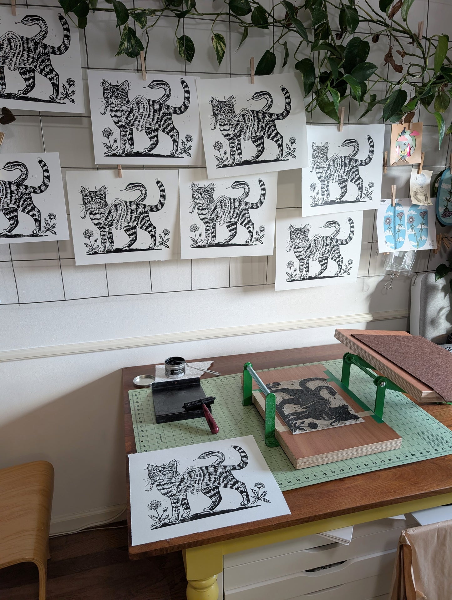 handprinted blockprint | caught (snake coiled around cat)