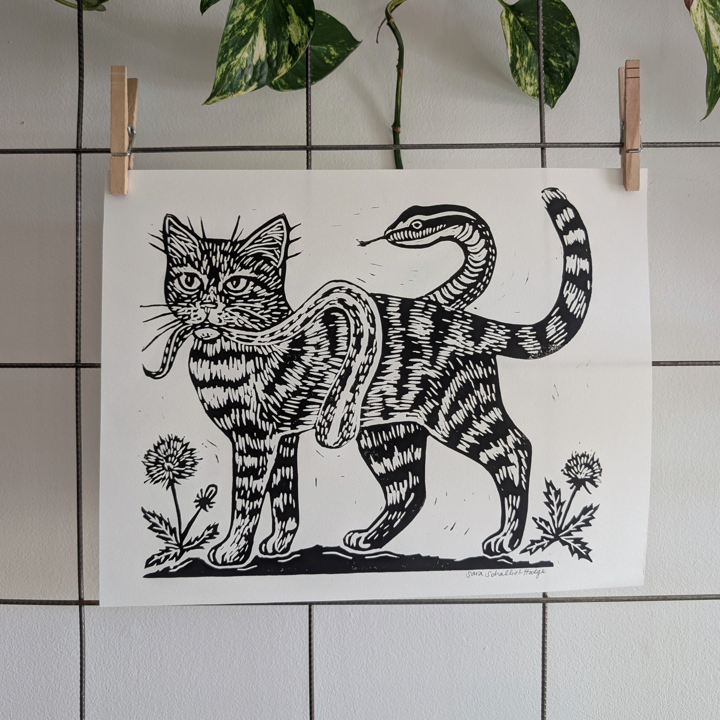 handprinted blockprint | caught (snake coiled around cat)