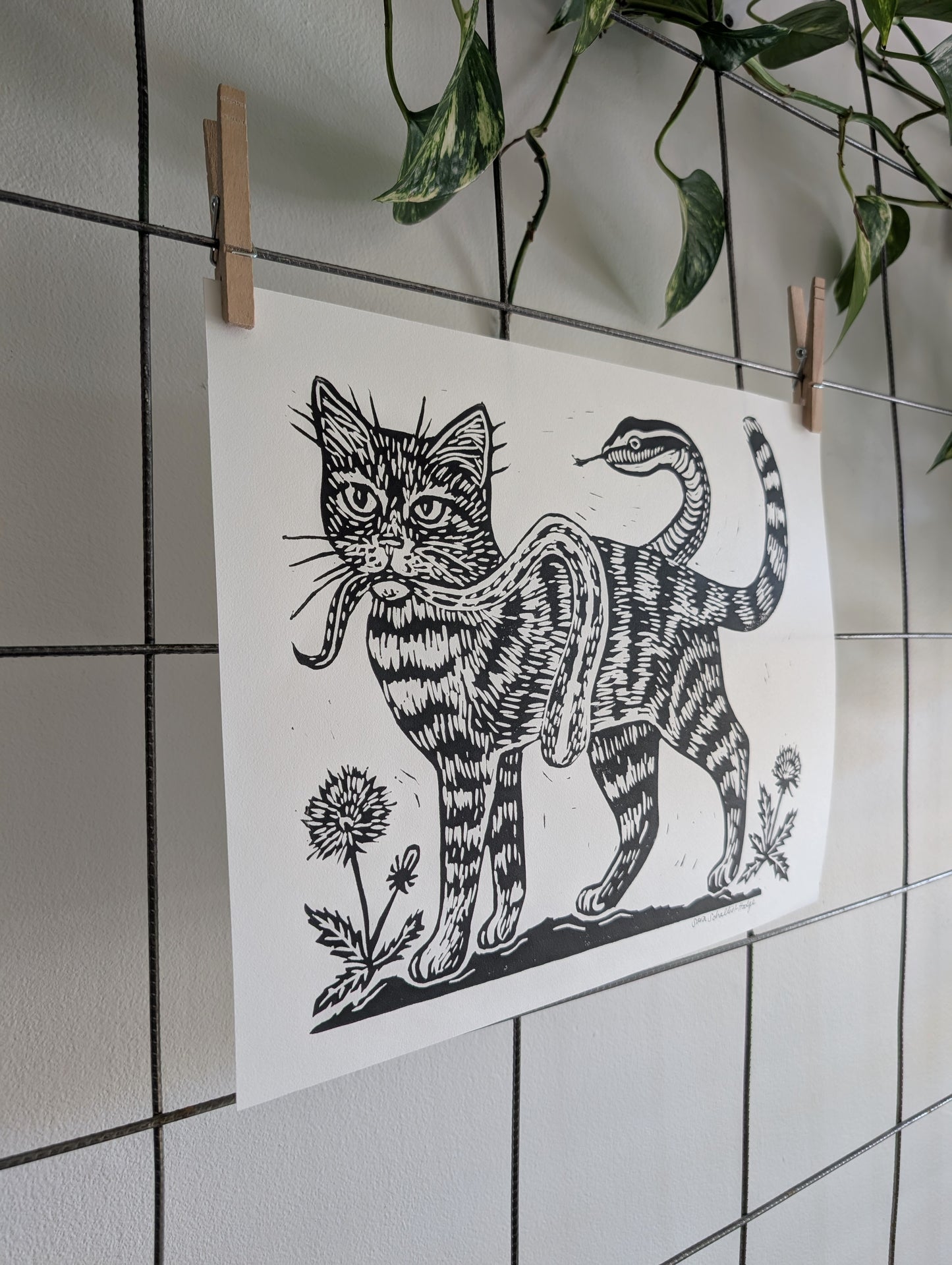 handprinted blockprint | caught (snake coiled around cat)