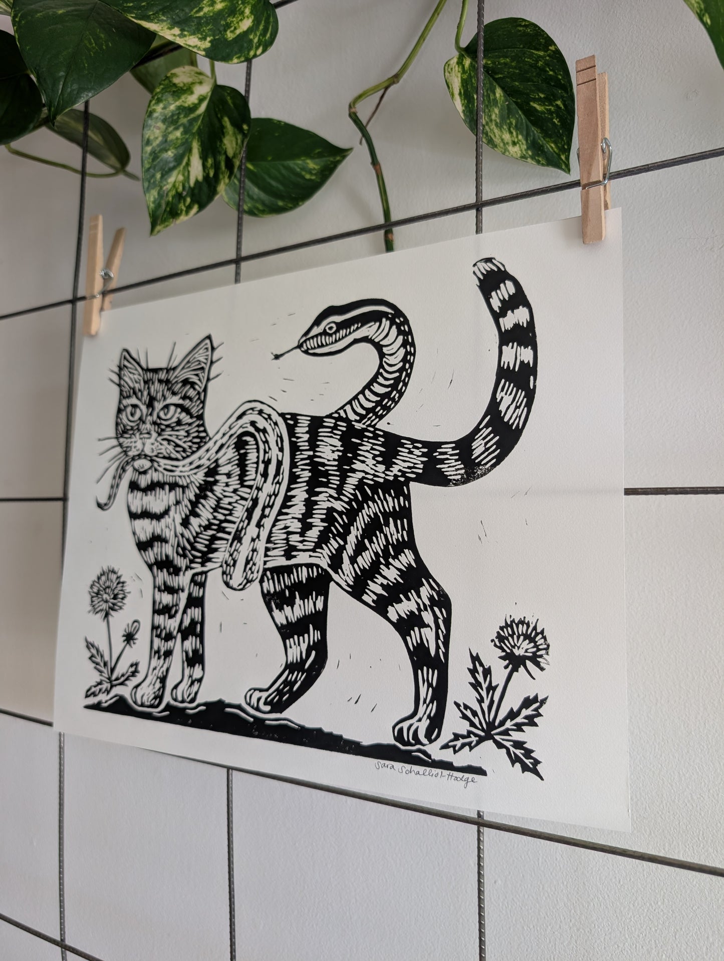 handprinted blockprint | caught (snake coiled around cat)