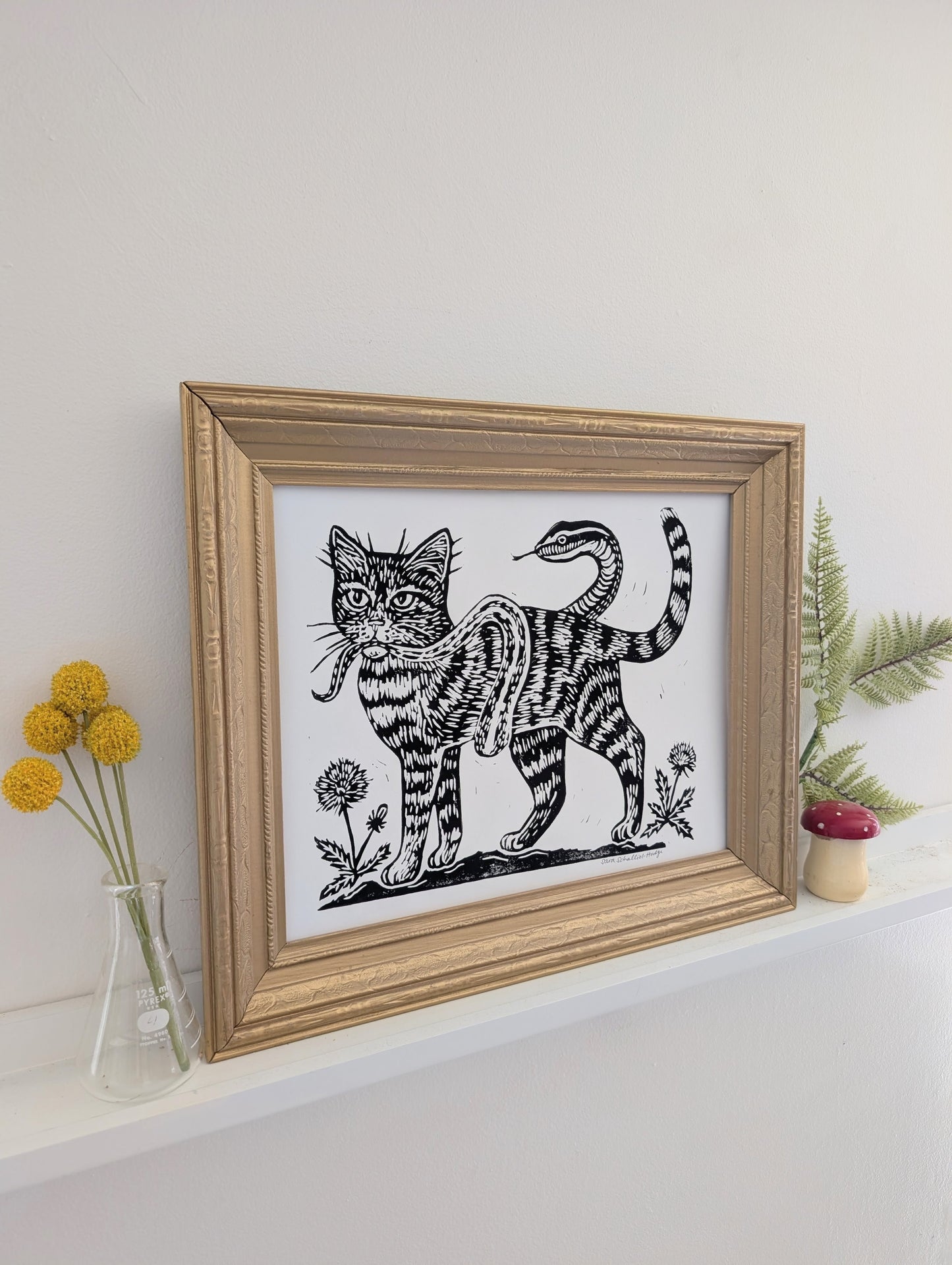 handprinted blockprint | caught (snake coiled around cat)