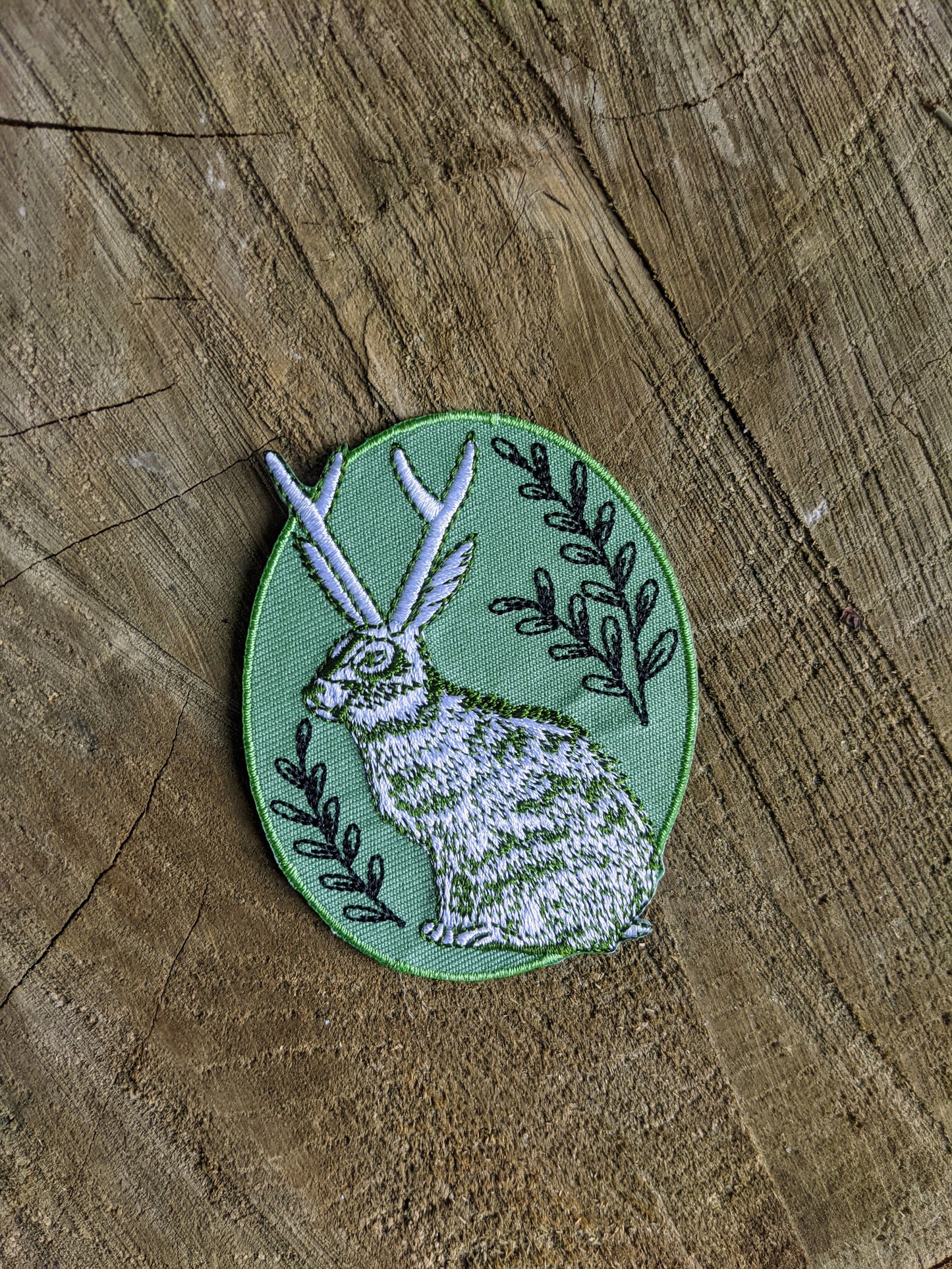 iron-on patch | jackalope - green oval 2.5" x 3.2"