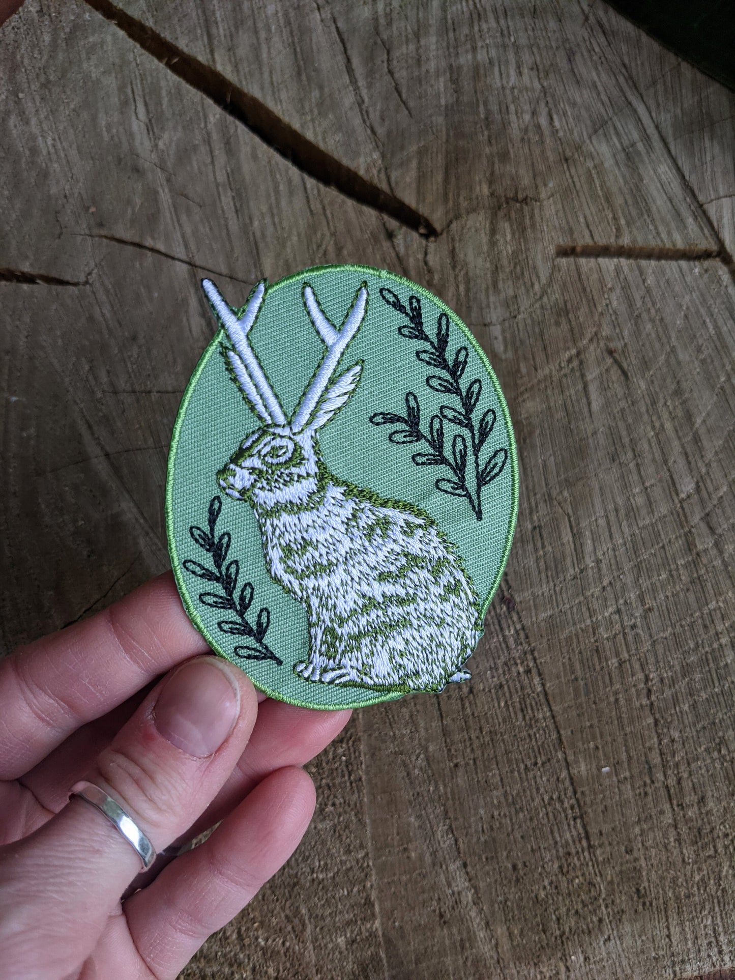 iron-on patch | jackalope - green oval 2.5" x 3.2"